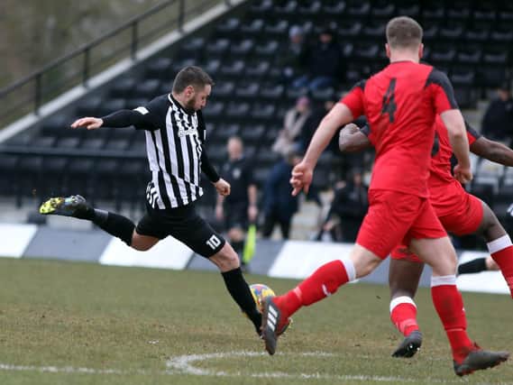 Steve Diggin fires home one of his four goals during Corby Town's 8-1 win over Wantage Town last weekend. Pictures by Alison Bagley