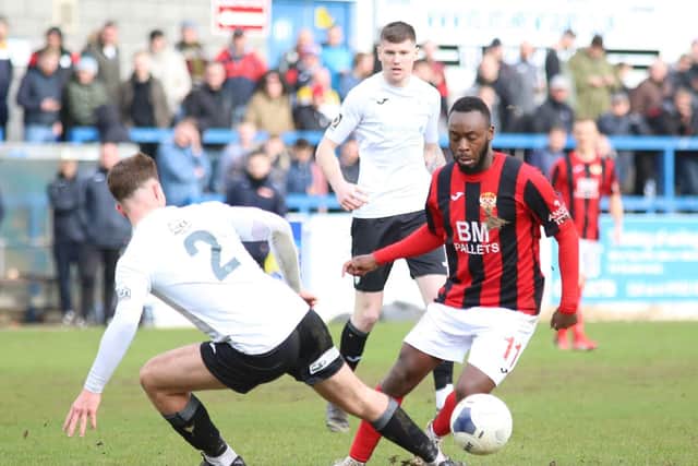 Omari Sterling-James, who scored Kettering Town's consolation, takes on AFC Telford United's Ryan Sears. Pictures by Peter Short