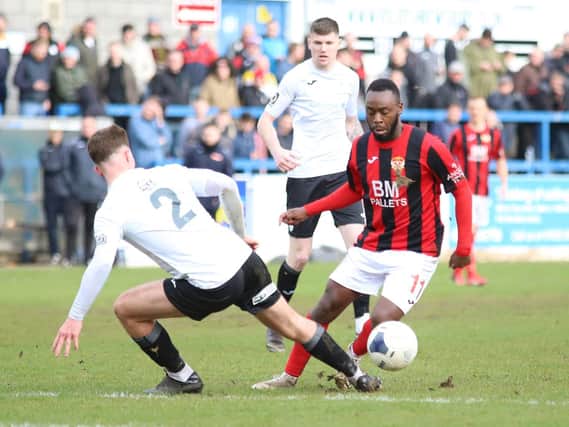 Omari Sterling-James, who scored Kettering Town's consolation, takes on AFC Telford United's Ryan Sears. Pictures by Peter Short
