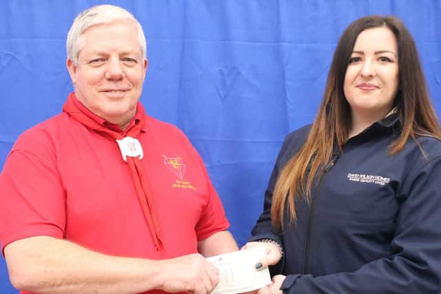 Mark Phipps receiving the donation