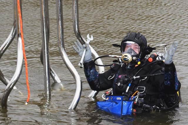 Su Eld-Weaver from GP Diving adjusts the foundations of the sculpture