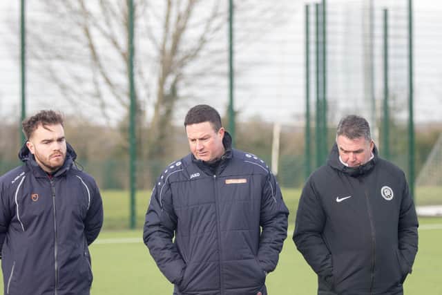 Kettering Town first-team coach Ben Marvin (left) has gone into self-isolation, manager Paul Cox has confirmed
