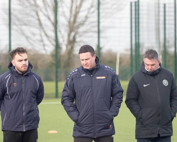 Kettering Town first-team coach Ben Marvin (left) has gone into self-isolation, manager Paul Cox has confirmed