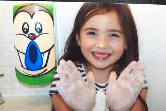 Daughter Emilia with the dispenser