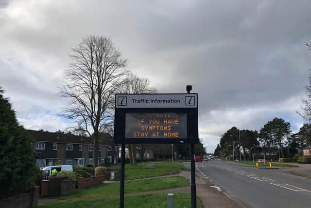 Public information signs across Northamptonshire are warning people with symptoms to stay at home