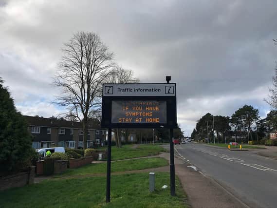 Public information signs across Northamptonshire are warning people with symptoms to stay at home
