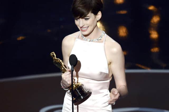 Anne Hathaway accepts the Best Supporting Actress award for Les Miserables onstage during the Oscars in 2013. Picture: Kevin Winter/Getty Images