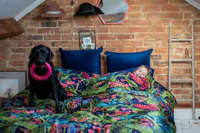 Emily and Oslo in bed. Photo: Dogs for Good