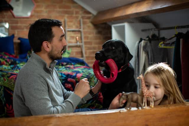 StevenChilvers with his daughter Emily and assistance dog Oslo. Photo: Dogs for Good