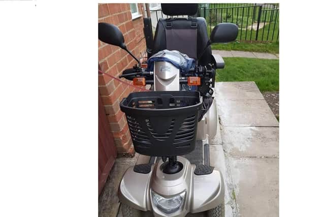 The stolen scooter in distinctive champagne colour