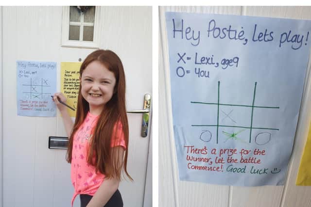 Lexi has challenged her postman to a game of noughts and crosses.