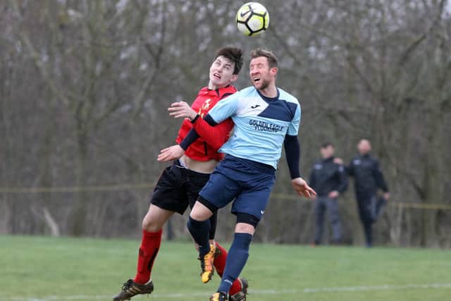 Chris Di Fante (in blue) in action for Kettering Nomads.
