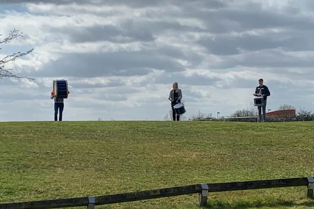 Grampian Pipe Band members play standing apart