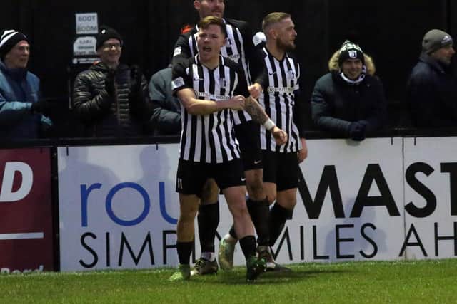 Jordon Crawford celebrates one of his goals as he hit a perfect hat-trick for Corby Town against Aylesbury United. Picture by Alison Bagley