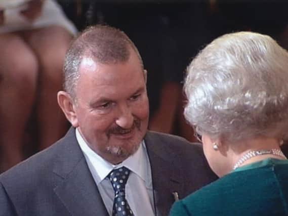 Ralph Baxter receiving his MBE from The Queen in 2007
