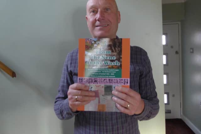Andy Goldsmith with a copy of his book celebrating the 125th anniversary of the United Counties League