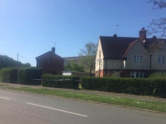 The taped-off house in Corby