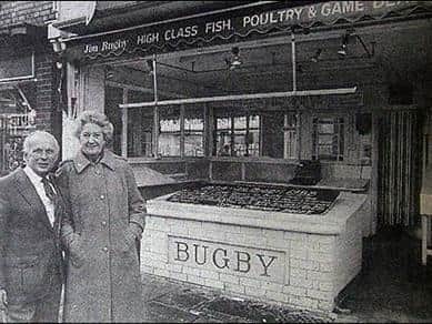 Jim and Margaret Bugby outside the shop in Rushden High Street
