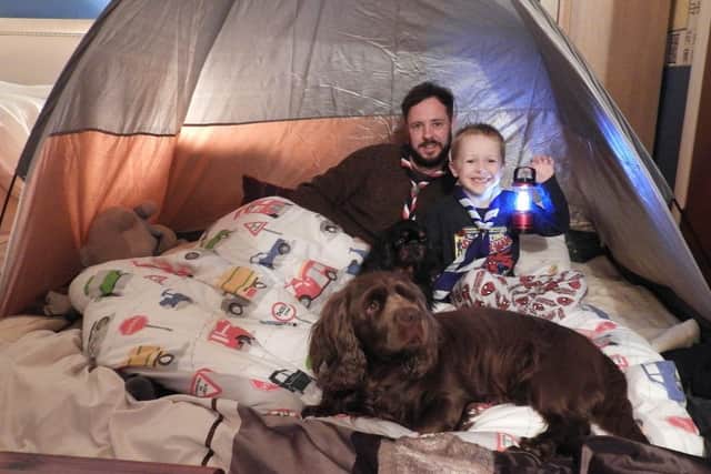 Scout leader Adam Graves with his son.