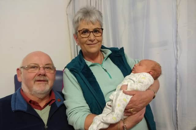 Ruth and husband Richard with their new grandson