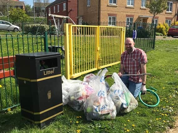 Lee Watkiss with some of the rubbish he has collected.