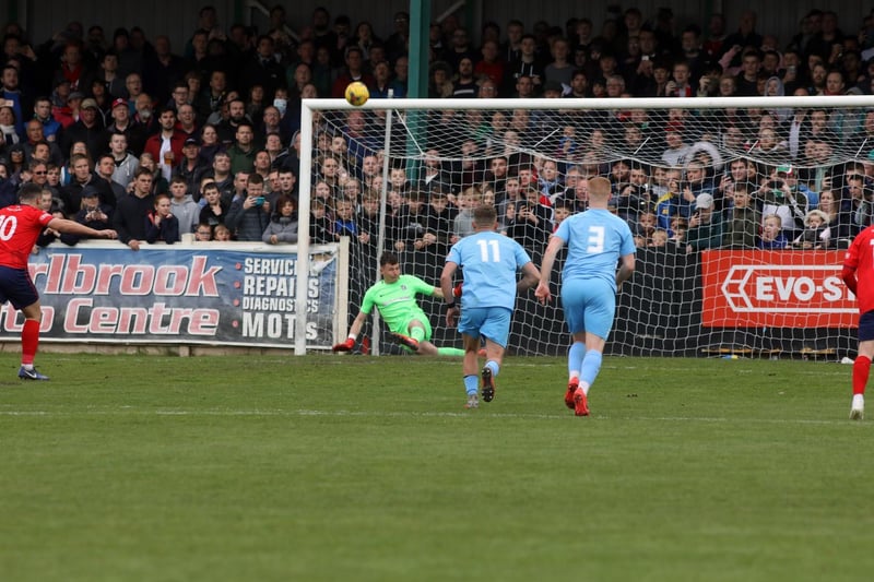 Corby goalkeeper Dan George saved two penalties on the day, including this one from Richard Gregory