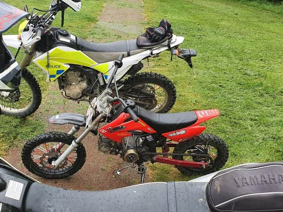 This red bike has been taken away by police officers who were riding their own off-roaders to help them catch the illegal riders