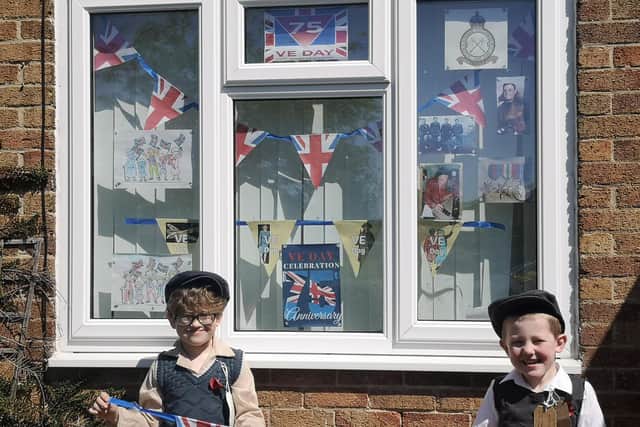 VE Day ready - six-year-old Xander Brawn and his brother Charlie, 5, dressed as evacuees.