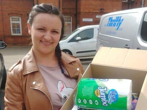 Kasia with one of the boxes of donations