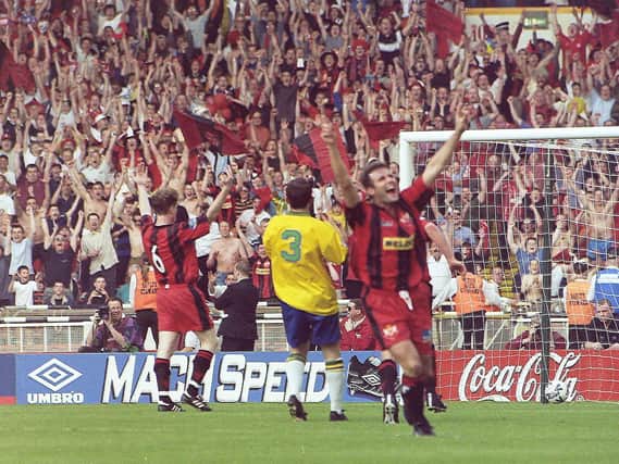 Craig Norman celebrates in front of the huge army of Kettering fans after putting the Poppies 2-1 up in the FA Trophy final at Wembley 20 years ago. Pictures by Mike Capps/www.kappasport.co.uk