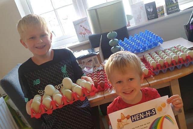 Maxi, 8, and Arlo, 4, are selling eggs for KGH and have named their set-up 'Hen-H-S'.
