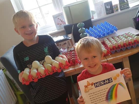 Maxi, 8, and Arlo, 4, are selling eggs for KGH and have named their set-up 'Hen-H-S'.