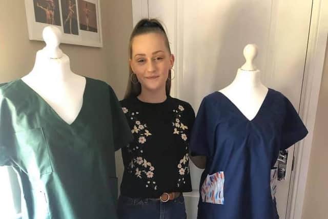 Year 13 student Megan Swales with the scrubs she has made.