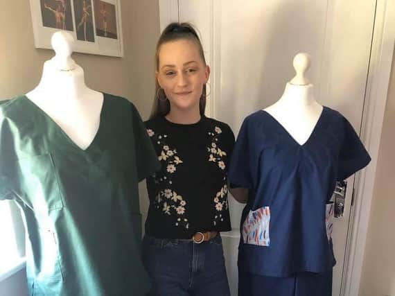 Year 13 student Megan Swales with the scrubs she has made.