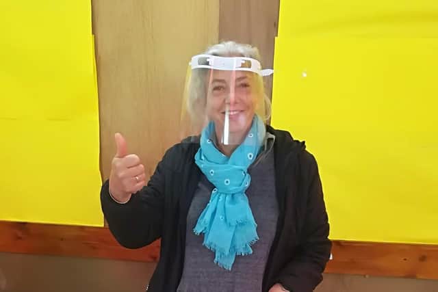 Liz Bull, head of design at Prince William School, wearing one of the visors she has produced for frontline health workers