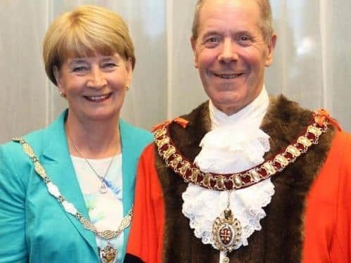 This Thursday's (May 20) annual council meeting has been postponed so Mayor Ray Beeby (pictured with wife Toni) will stay in office for a while longer.