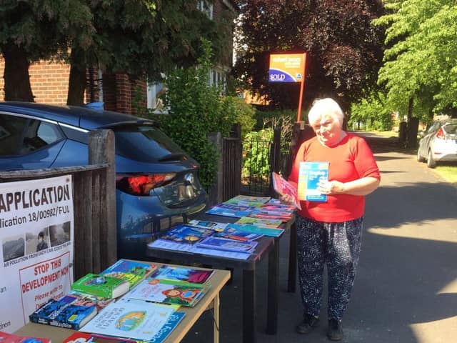 Dorothy Maxwell with her book stall in Higham Road, Rushden