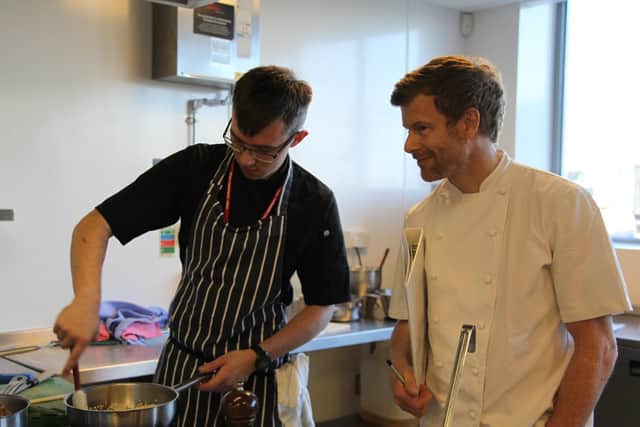 Charlie Garrett, being observed by judge Tom Aikens at the 'Booker Young Chef of the Year' final last September