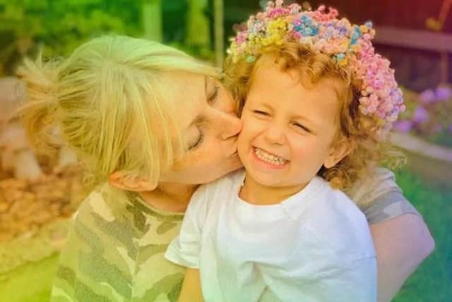 Florist Kirsty with grandson Carter, 4, modelling a floral head band
