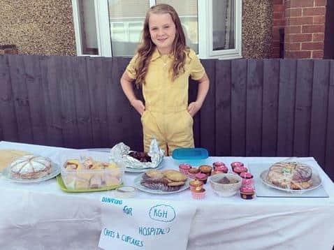 Isla held the bake sale outside her home