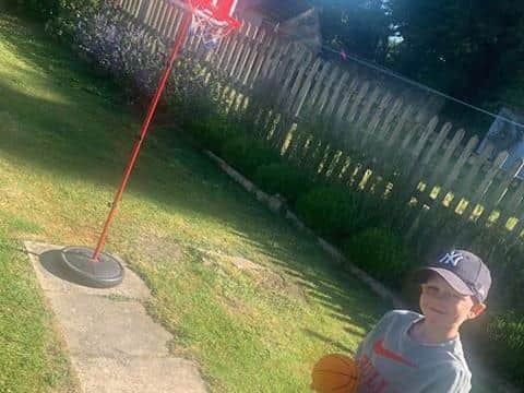 Eddie prepares to shoot hoops