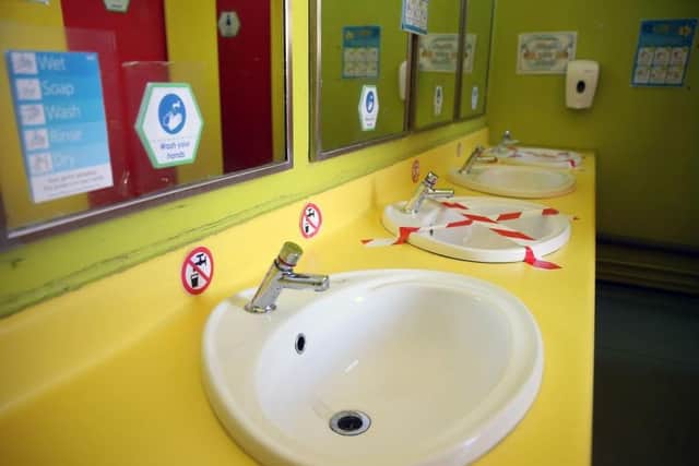 Basins are blocked off to so children can wash their hands safely. Photo: Getty Images