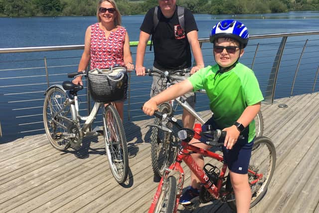 Euan and his mum and dad at Rushden Lakes