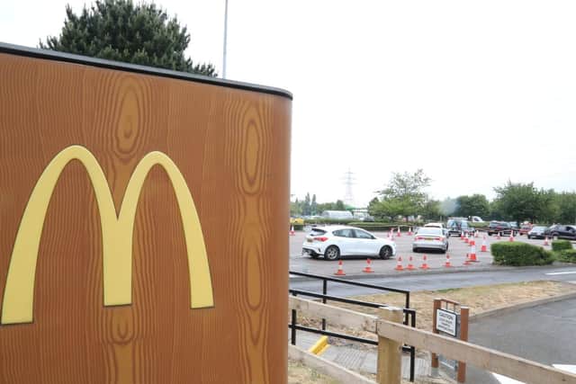 Cars queue to get into the McDonald's by Phoenix Parkway in Corby.