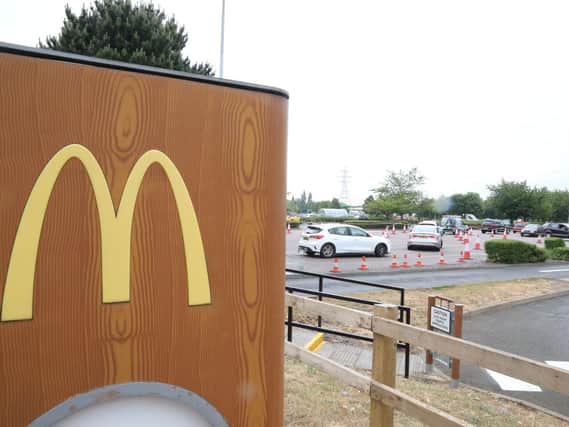 Cars queue to get into the McDonald's by Phoenix Parkway in Corby.