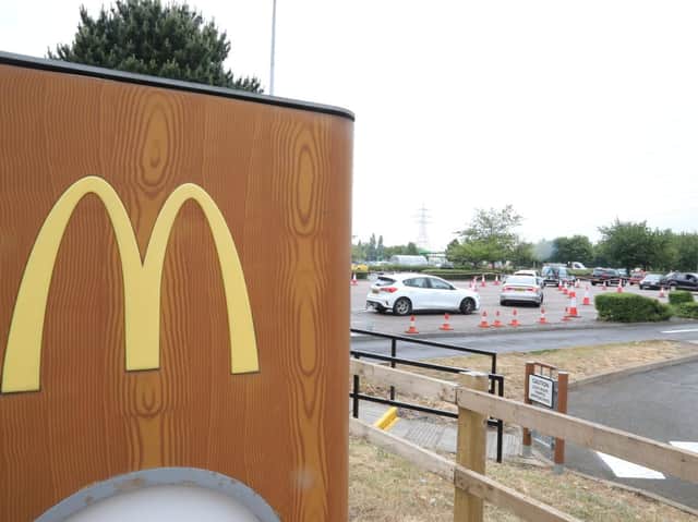 Cars queue to get into the McDonald's by Phoenix Parkway in Corby.