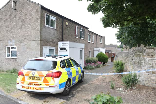 Police at the house in Pages Walk, Corby, yesterday (Wednesday)