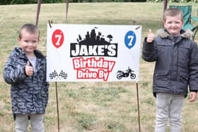 Jake (right) with little brother Korie at the birthday drive-by bash.