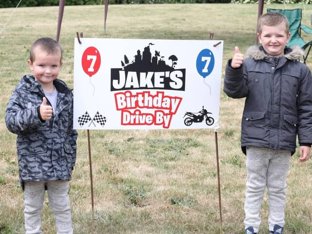 Jake (right) with little brother Korie at the birthday drive-by bash.