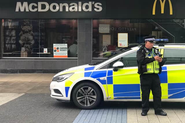 Police outside Corby's McDonald's.